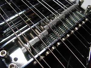 Click image for larger version. 

Name:	12 string bridge.jpg 
Views:	278 
Size:	99.6 KB 
ID:	25346