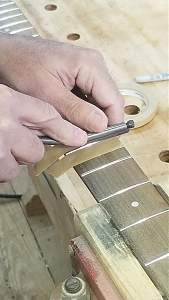 Click image for larger version. 

Name:	Filing the frets.jpg 
Views:	615 
Size:	249.7 KB 
ID:	42885