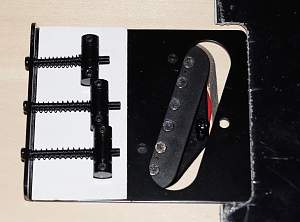 Click image for larger version. 

Name:	bridge moved to pickguard.jpg 
Views:	327 
Size:	436.2 KB 
ID:	8706